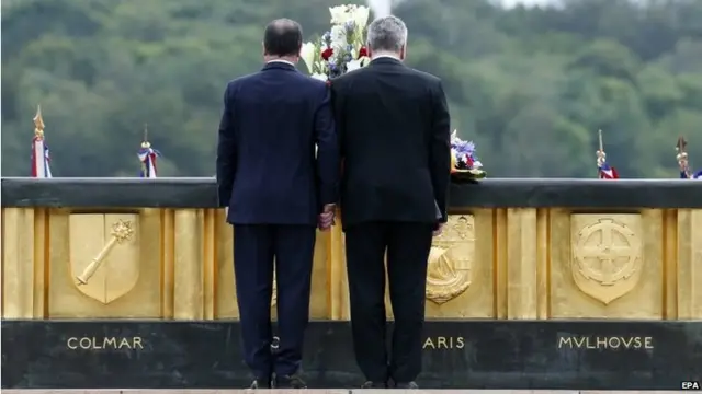 French President Francois Hollande (C-L) and German President Joachim Gauck (C-R) attend the ceremony marking the 100th anniversary of the outbreak of World War I, at the National Monument of Hartmannswillerkop, in Wattwiller, France