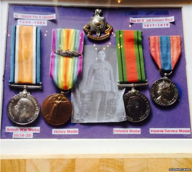 Photograph of Edward Hobbs amidst war medals