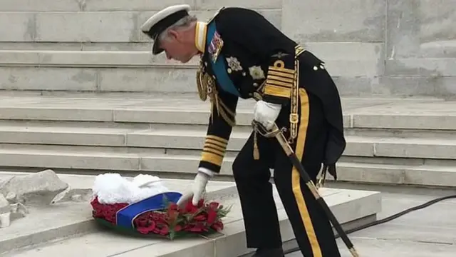 Prince Charles lays the first wreath at the service in George Square in Glasgow