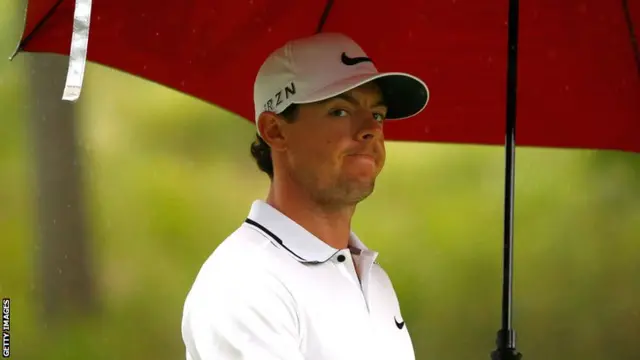 Rory McIlroy endures the rain at the US PGA