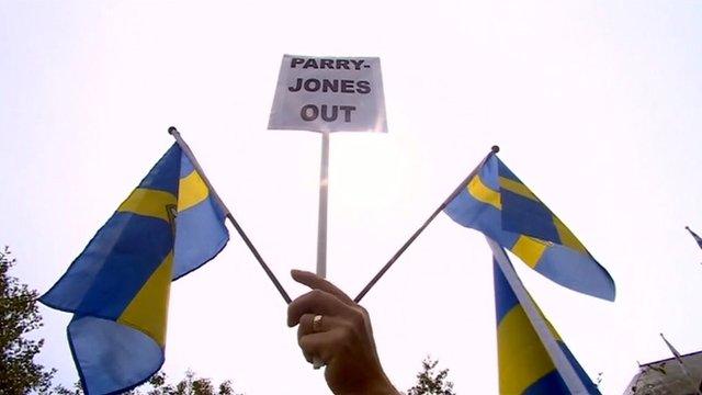 Protester's flags and placard