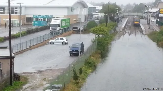 some pics of central elgin within the last hour including main rail line at the station. One shot looks more like a canal than the mainline to Aberdeen!