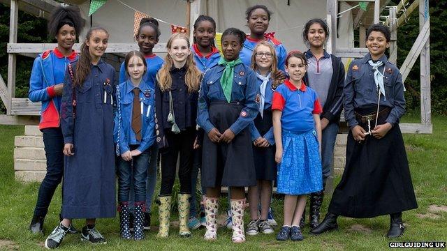 Girl Guides wearing a mixture of old and new uniforms