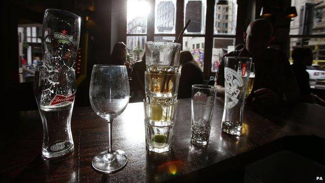 Glasses stacked on a bar