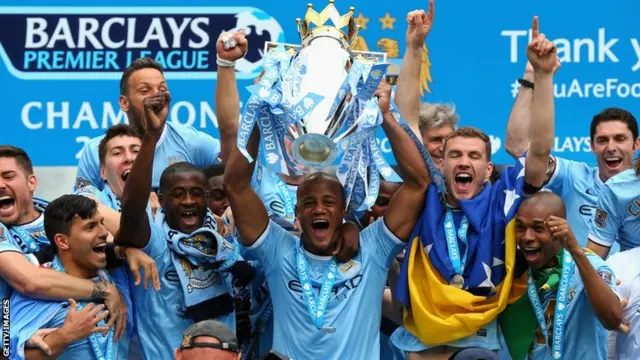 Manchester City with the Premier League trophy