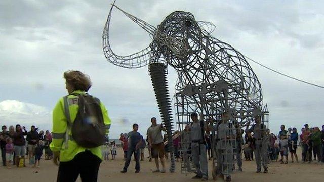 Replica mammoth walking on West Runton beach