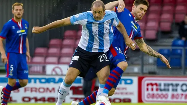 Dundee's Gary Harkins (left) and Greg Tansey battle for possession