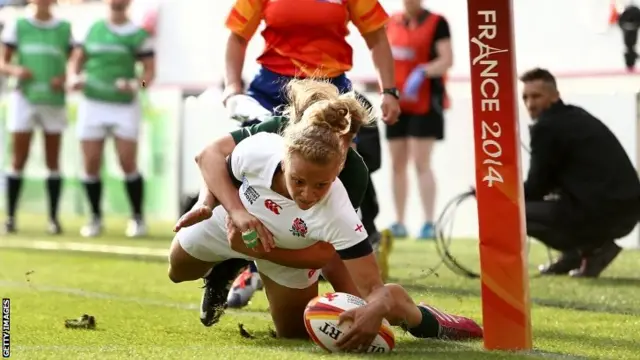 Kay Wilson of England touches down