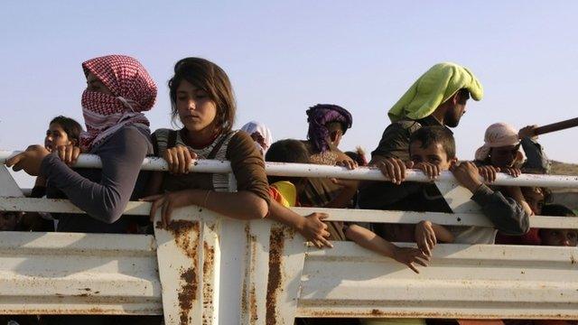 Displaced people from the minority Yazidi sect, fleeing the violence in the Iraqi town of Sinjar