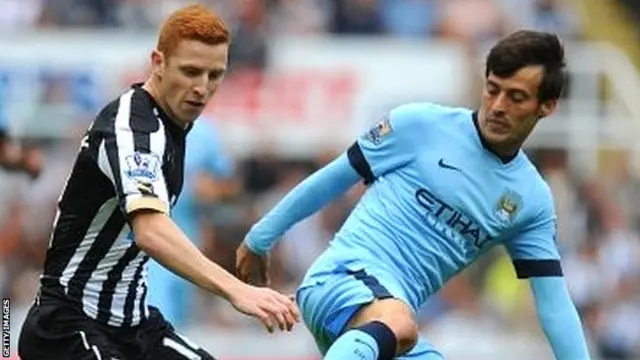 Jack Colback (left) in action for Newcastle against Manchester City