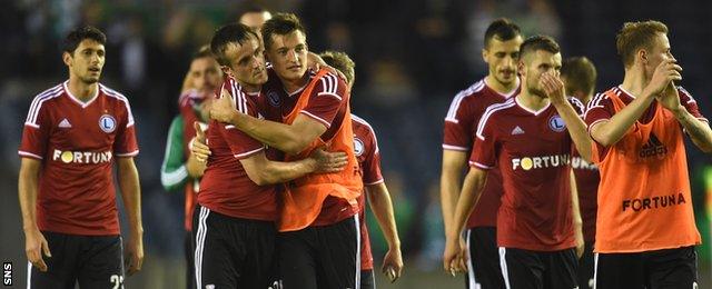 The Legia Warsaw players congratulate one another after the 2-0 win over Celtic at Murrayfield