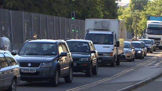 Traffic alongside the fence