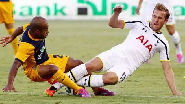 Carlitos of AEL in action against H. Kane of Tottenham