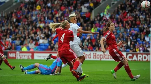 Karen Carney scores