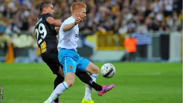 Hull City"s player Paul McShane vies for the ball