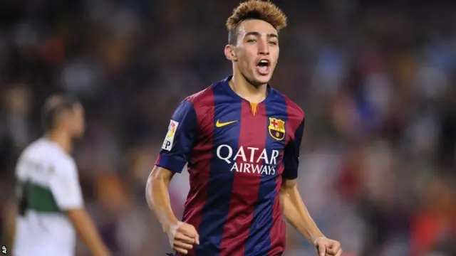 Barcelona's Munir reacts after scoring