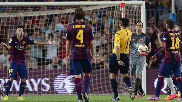 Argentinian midfielder Javier Mascherano reacts after being sent off