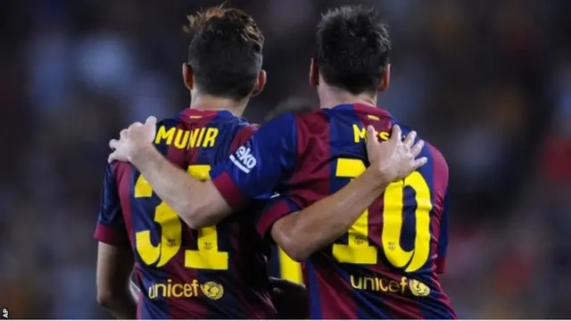 FC Barcelona's Lionel Messi from Argentina, reacts after scoring with his teammate Munir