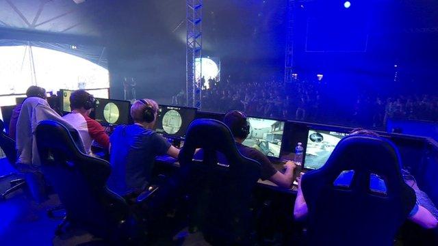 Video gamers watched by crowd