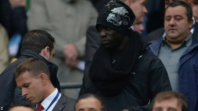 Liverpool's new signing Mario Balotelli watches his new team