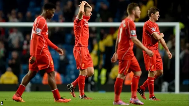 Liverpool players look dejected after the final whistle