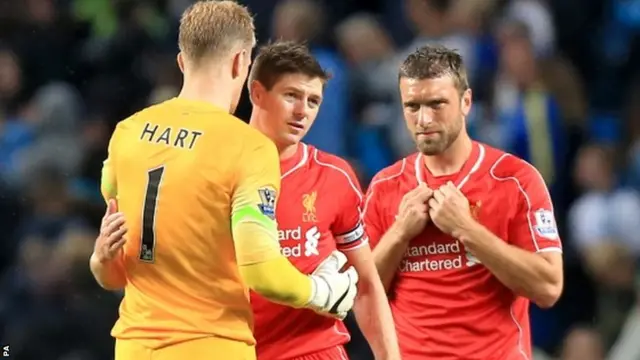 Manchester City goalkeeper Joe Hart greets Liverpool's Steven Gerrard