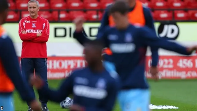 Crystal Palace caretaker manager Keith Millen watches his players warm up