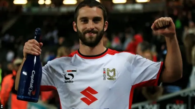 Milton Keynes Dons goalscorer Will Grigg with the man of the match award