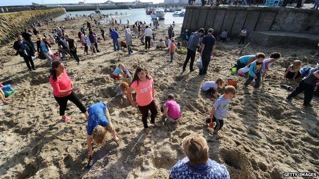 Digging for gold on Folkestone beach