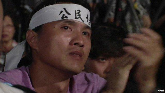 Protester with headband taking part in pro-democracy demonstration in Hong Kong