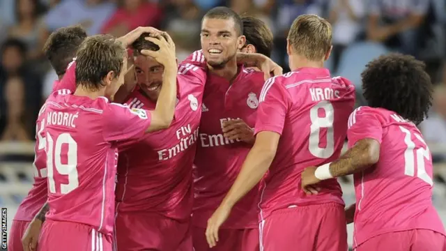 The Real Madrid players celebrate Sergio Ramos' goal