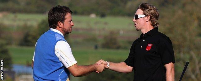 Graeme McDowell (left) congratulated by Hunter Mahan at Celtic Manor in 2010