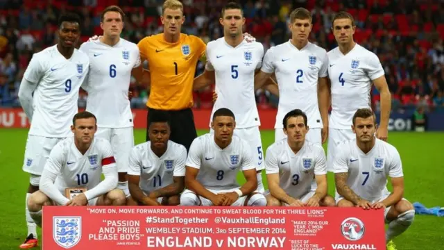 The England squad lines up prior to the International friendly