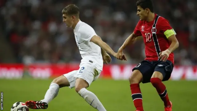 England's defender John Stones vies with Norway's Tarik Elyounoussi