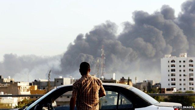 Smoke billows over Tripoli amid fighting for control of the capital