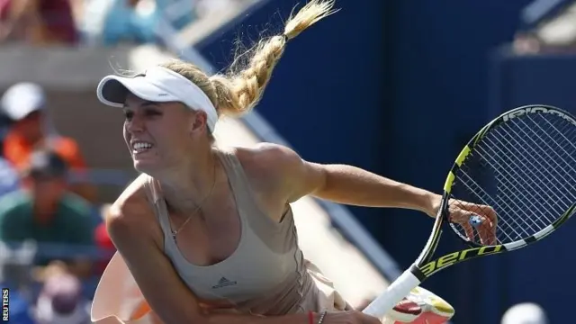 Caroline Wozniacki of Denmark serves