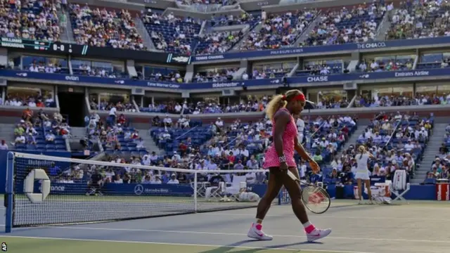 Serena Williams, of the United States, walks to the other side of the court