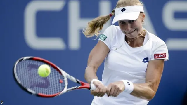 Ekaterina Makarova, of Russia, returns a shot