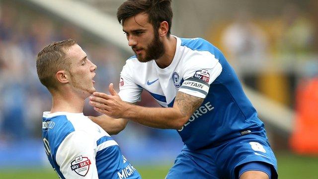 Marcus Maddison (left) is congratulated by Peterborough team-mate Jack Payne after scoring against Port Vale