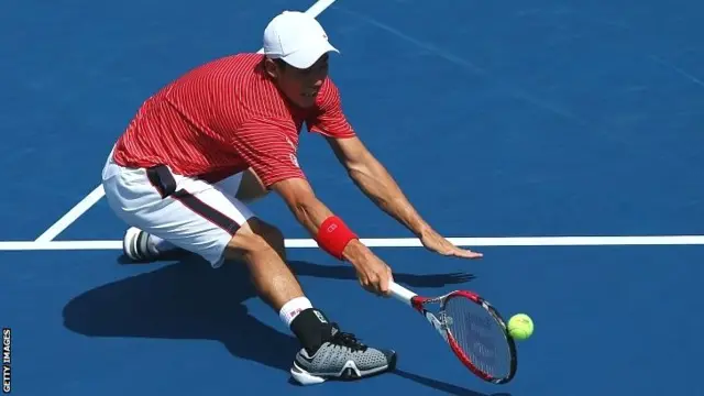 Kei Nishikori of Japan returns a shot