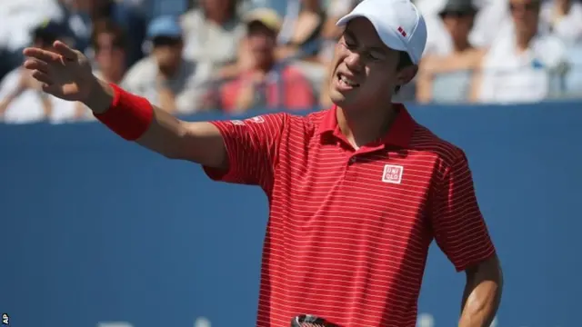 Kei Nishikori, of Japan, reacts after a shot against Novak Djokovic