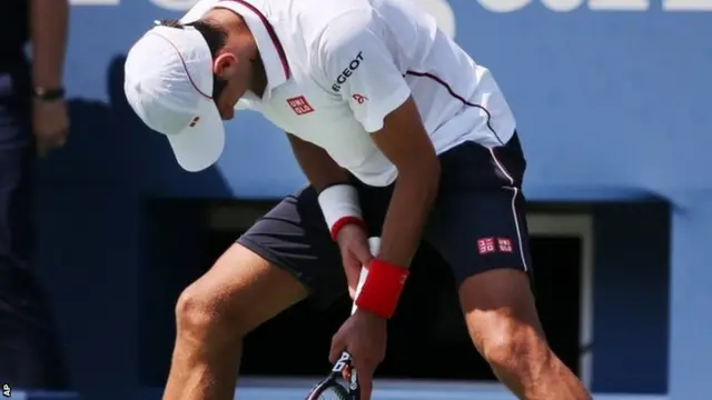 Novak Djokovic, of Serbia, reacts after a shot against Kei Nishikori