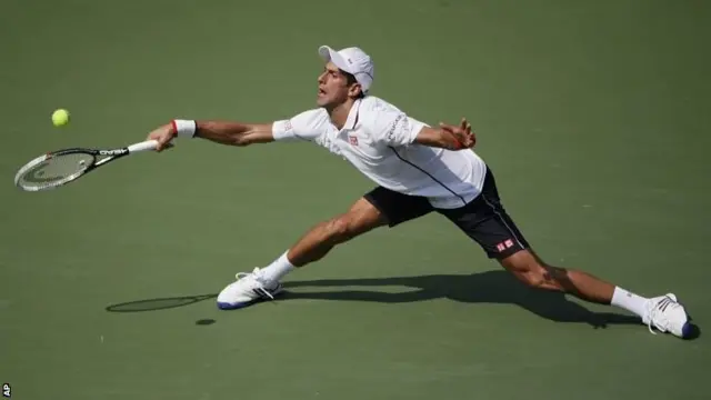 Novak Djokovic stretches