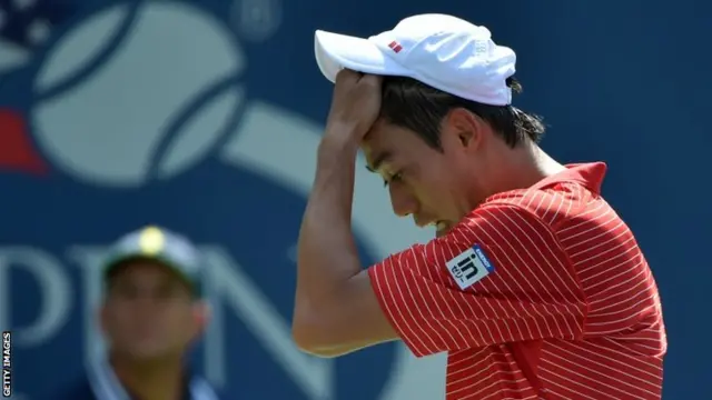 Kei Nishikori of Japan reacts against Novak Djokovic of Serbia