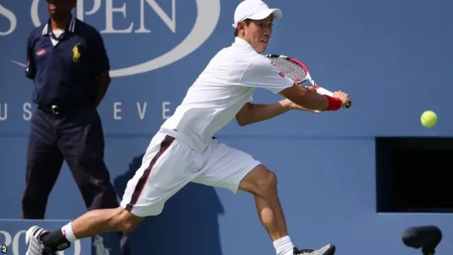 Kei Nishikori, of Japan, returns a shot against Novak Djokovic