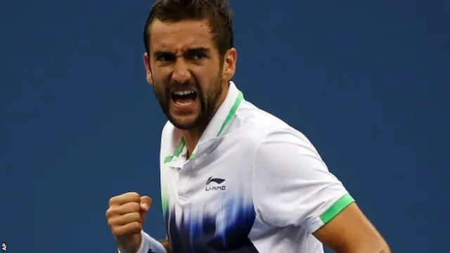 Marin Cilic, of Croatia, reacts after a shot against Roger Federer