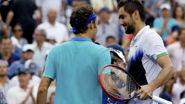 Marin Cilic of Croatia shakes hands with Roger Federer