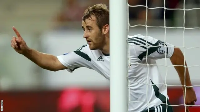 Niall McGinn of Northern Ireland celebrates his goal