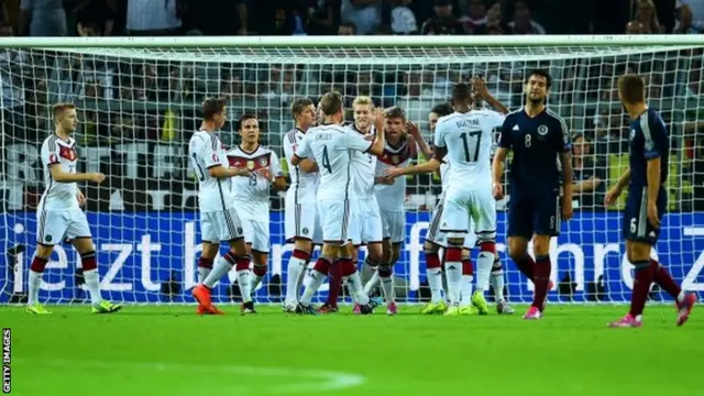 Thomas Mueller of Germany is congratulated by team mates