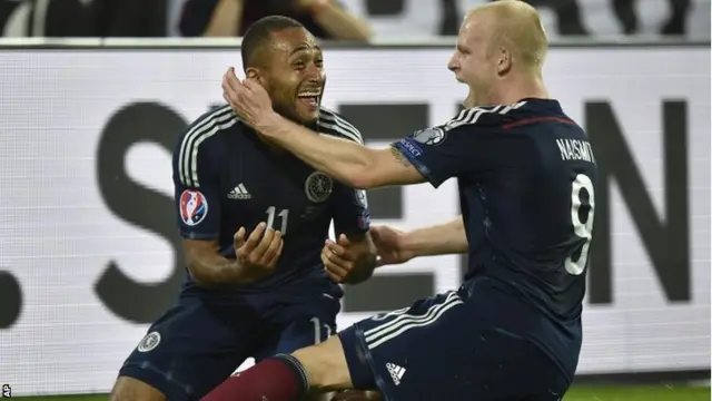 Ikechi Anya celebrates with teammate Steven Naismith